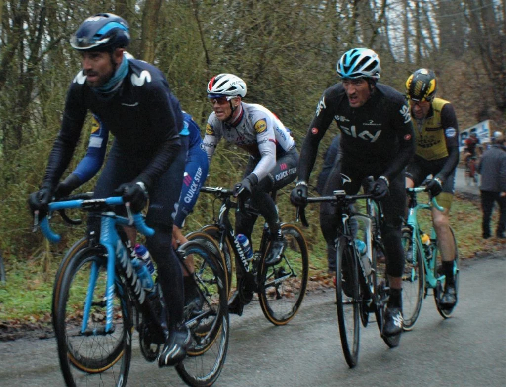 A group of people riding on the back of a bicycle - Road bicycle racing