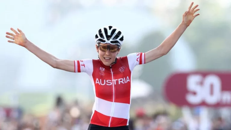 Tokyo 2020 Olympics - Cycling - Road - Women's Road Race - Final - Tokyo to Fuji International Speedway - Tokyo, Japan - July 25, 2021. Anna Kiesenhofer of Austria celebrates winning gold. REUTERS/Christian Hartmann