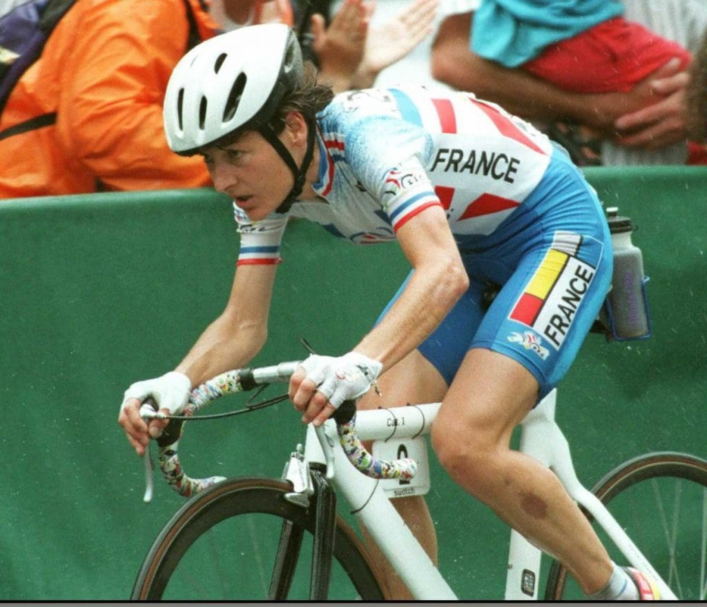 French cyclist Jeannie Longo races on her way to winning the women's Olympic road race 21 July in Atlanta. Longo, a 10-time world record cycling champion, claimed a gold medal on her fourth attempt in the event, finishing in 2 hours, 36 minutes and 13 seconds.