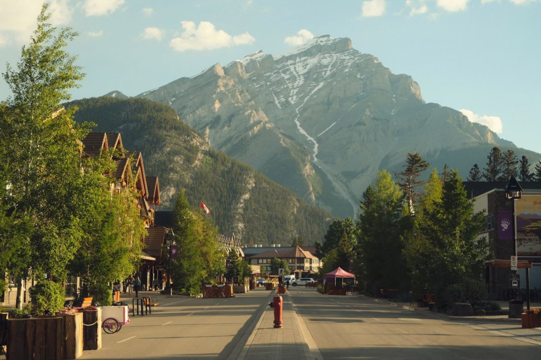 A street with a mountain in the background