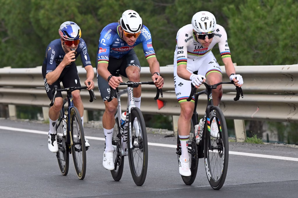 SANREMO, ITALY - MARCH 21: (L-R) Thomas Pidcock of Great Britain and Team Pinarello Q36.5 Pro Cycling, Mathieu van der Poel of Netherlands and Team Alpecin-Premier Tech and Tadej Pogacar of Slovenia and UAE Team Emirates - XRG compete in the breakaway during the 117th Milano-Sanremo 2026, Men's Elite a 298km one day race from Pavia to Sanremo / #UCIWT / on March 21, 2026 in Sanremo, Italy. (Photo by Dario Belingheri/Getty Images)