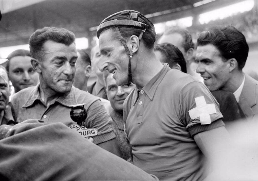 Race winner Louison Bobet and Swiss competitor Ferdinand Kubler at the finish of the Tour de France in the Parc des Princes, Paris, 26th July 1953. (Photo by Roger Viollet/Getty Images)