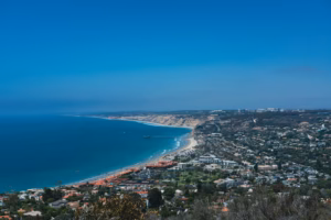 aerial view of city near body of water during daytime