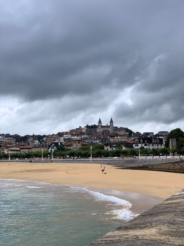 people on beach during daytime san sebastian