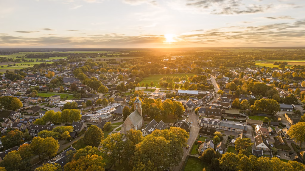 A stunning drone shot of Ruinen village at sunset showcasing a picturesque landscape.