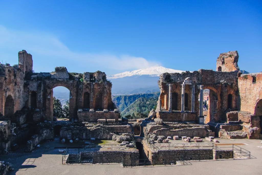 Sicily the ruins of a building with a mountain in the background