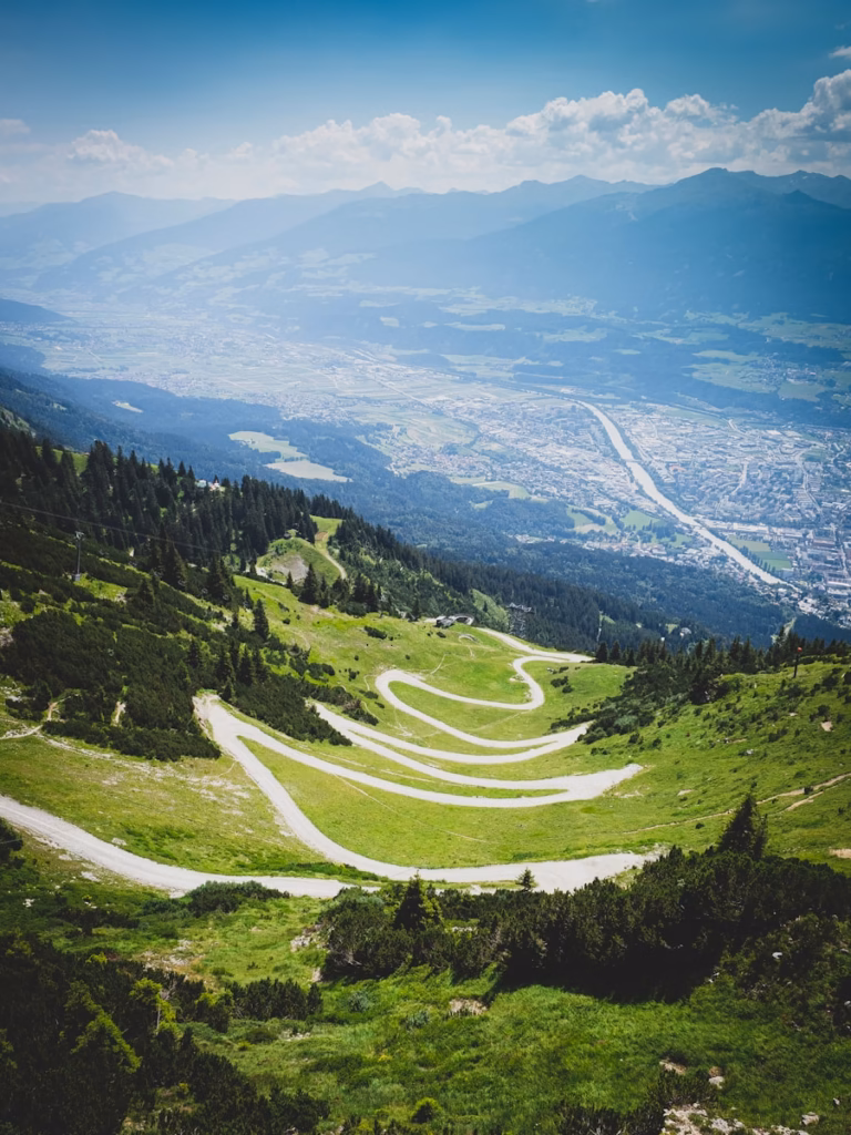 green trees on mountain under blue sky during daytime