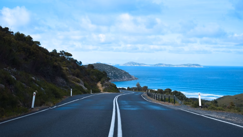 Gold Coast gray concrete road near body of water during daytime