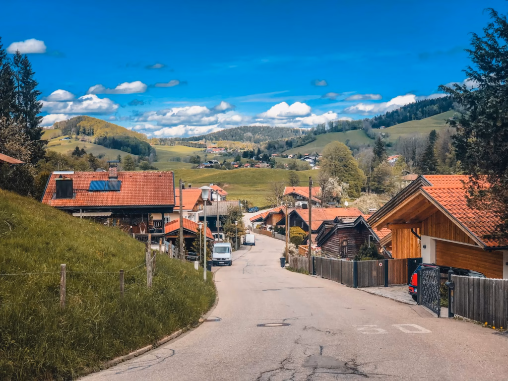 Bavaria Alps brown wooden houses near green grass field during daytime