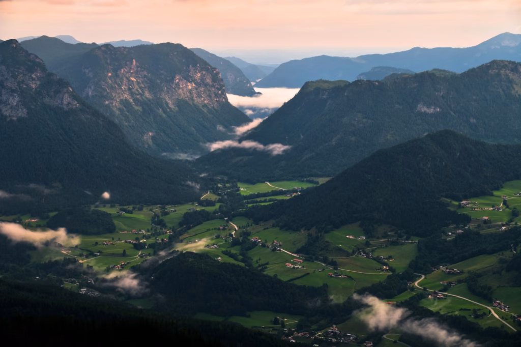 Bavaria Alps Green valley with misty mountains at sunrise