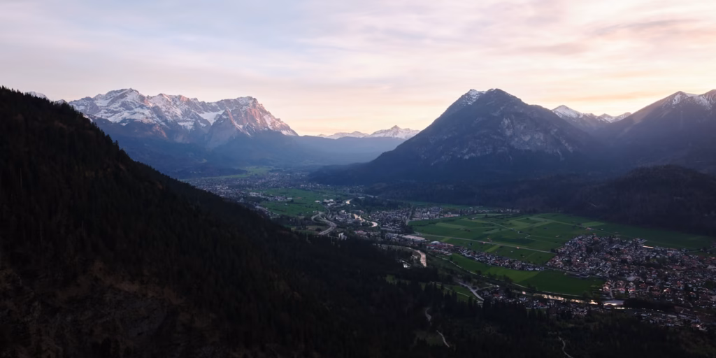 Bavaria Alps A scenic view of a town and mountains