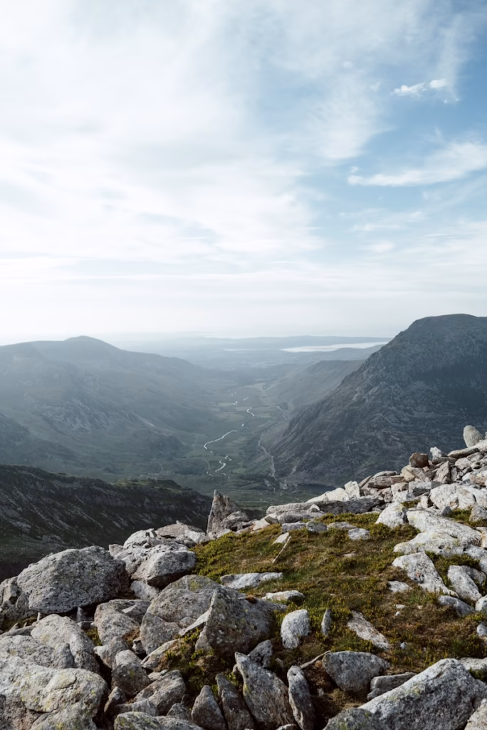 Wales Valley rocky mountain under white sky during daytime