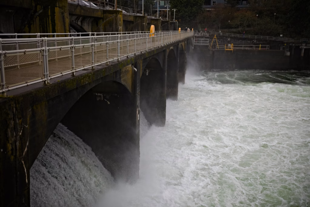 Seattle Washington Cascades Water flowing through a dam with arches