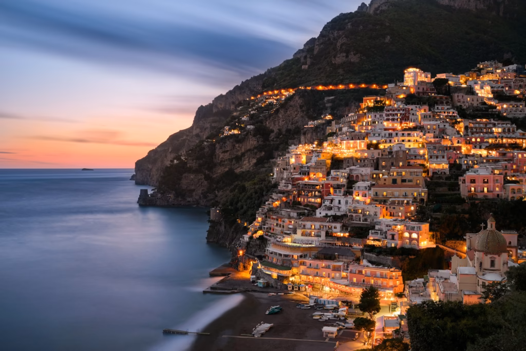 Amalfi Coast city buildings on mountain near body of water during daytime