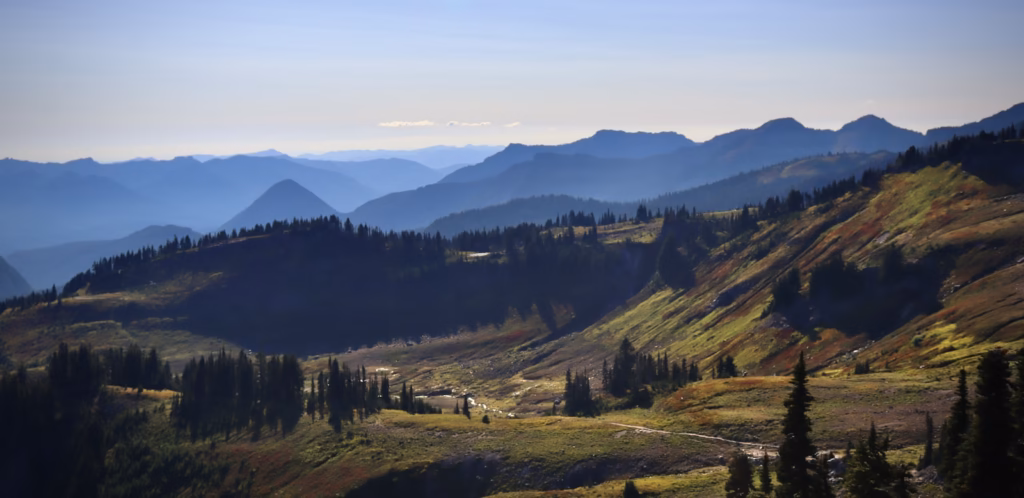 Seattle Washington Cascades a view of a mountain range with trees and mountains in the background
