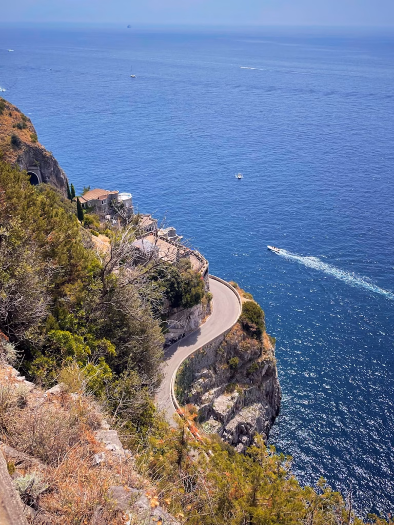 Amalfi Coast green trees on cliff by the sea during daytime
