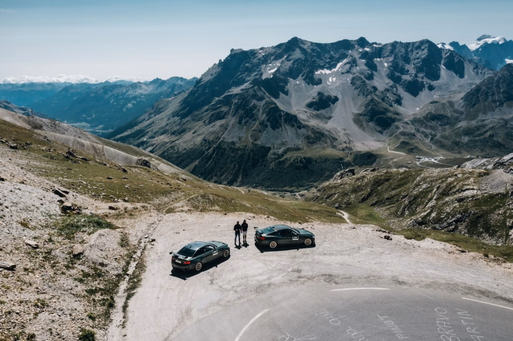 Col du Galibier black suv on gray road near snow covered mountain during daytime