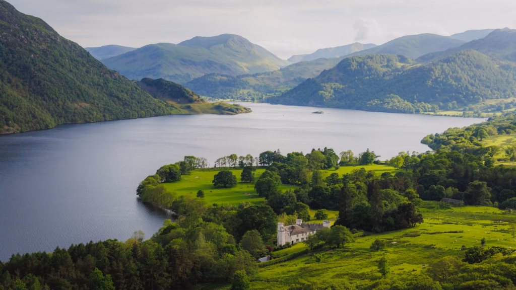 Lake District A beautiful lake is surrounded by green mountains.