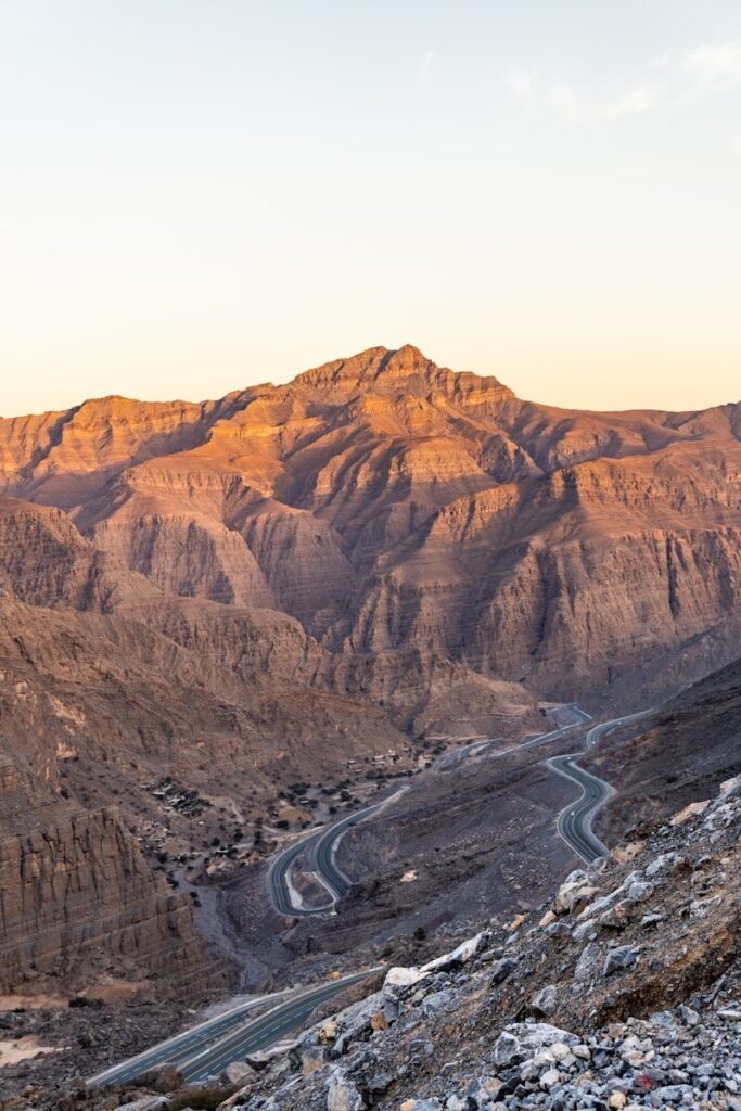 Jebel Jais Winding road ascends a mountain under a beautiful sky.