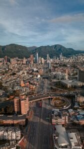Bogota an aerial view of a city with mountains in the background