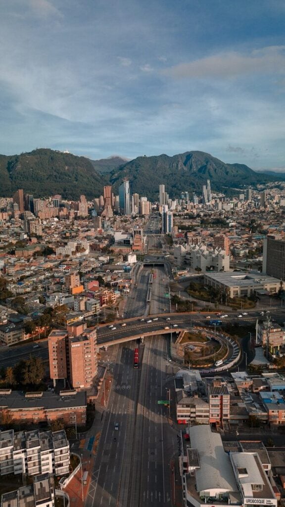 Bogota an aerial view of a city with mountains in the background