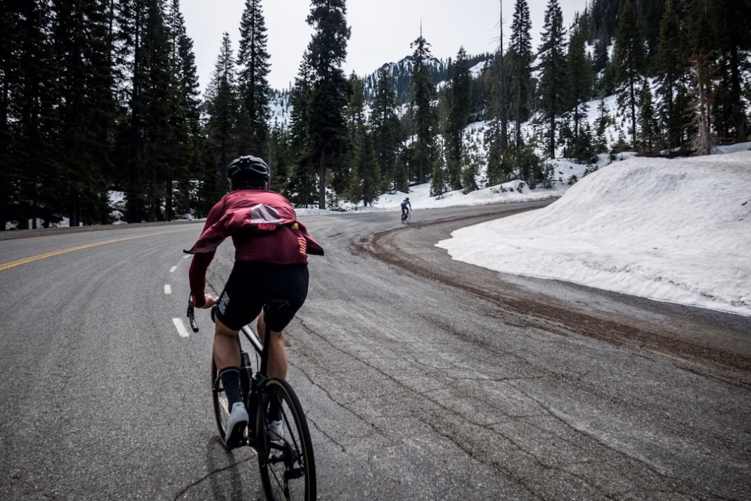 Cyclist riding on a wet winter road