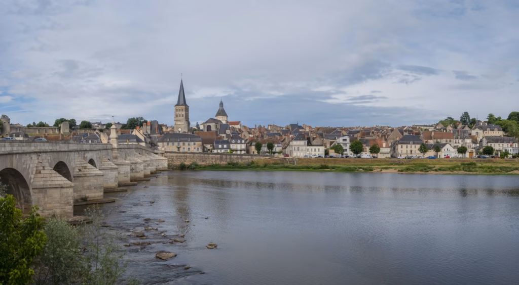 Loire Valley a bridge over a river with a city in the background