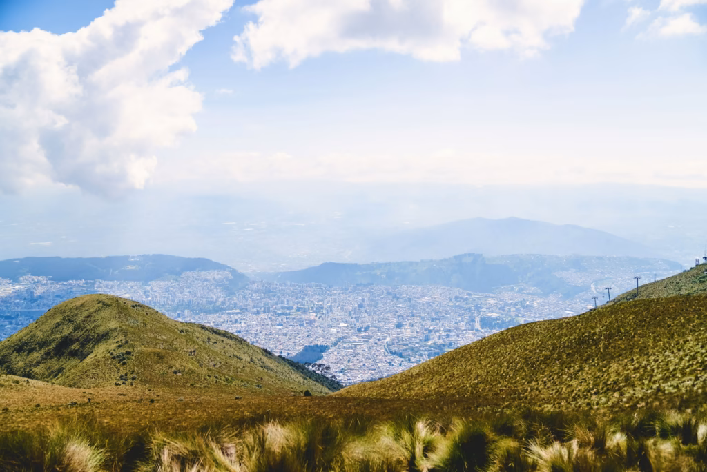 Quito a view of a city from the top of a hill