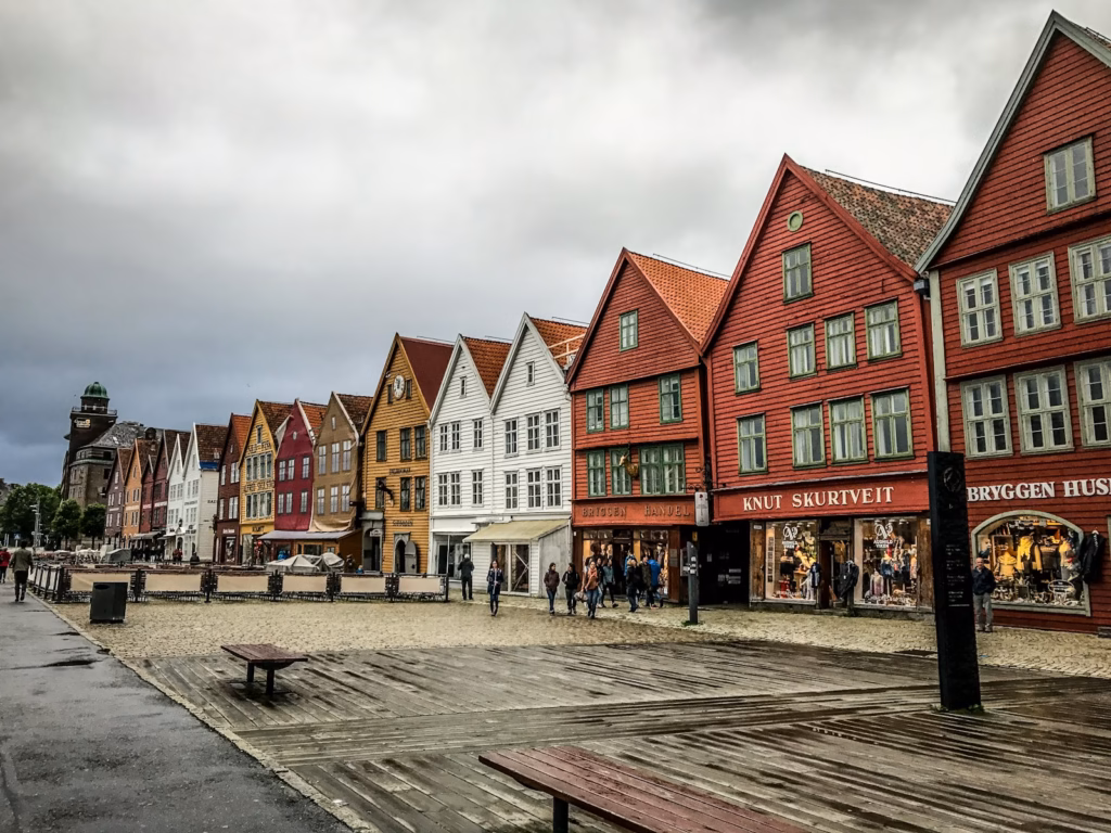 Bergen Norway people standing near concrete houses