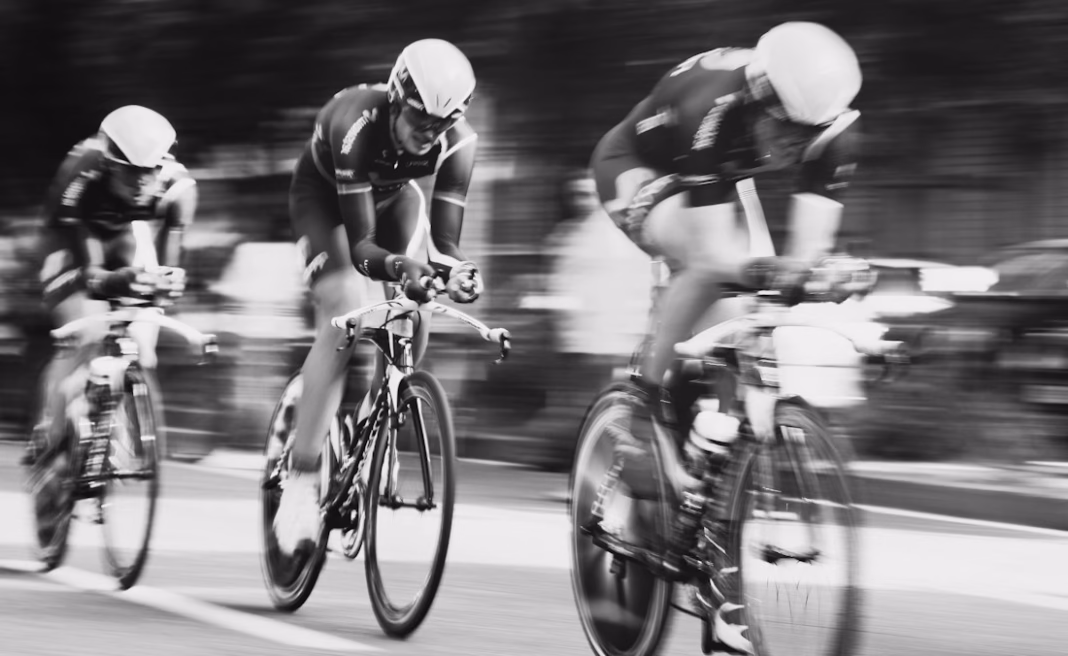Riders racing on the road, illustrative image